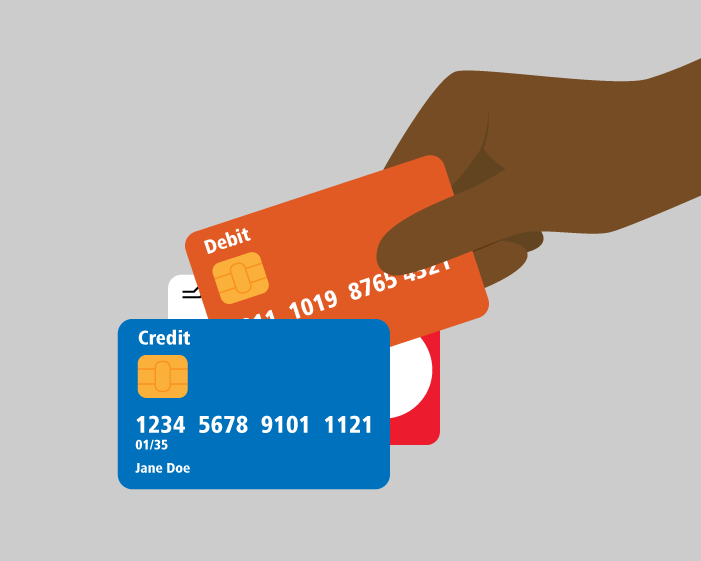 A hand grasping a debit card.