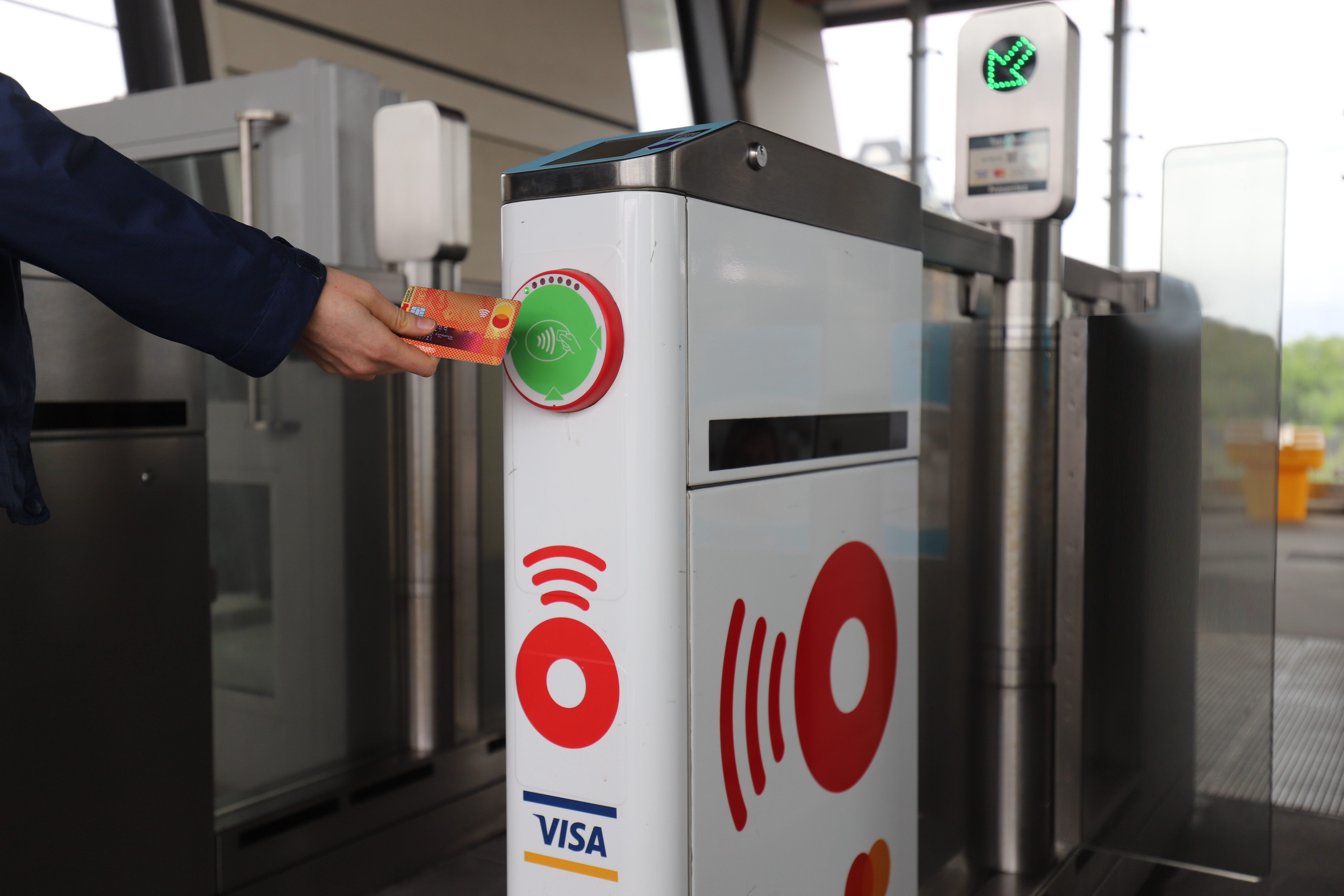 Look for the specially marked white fare gates which have already been activated to accept credit card and mobile phone taps.