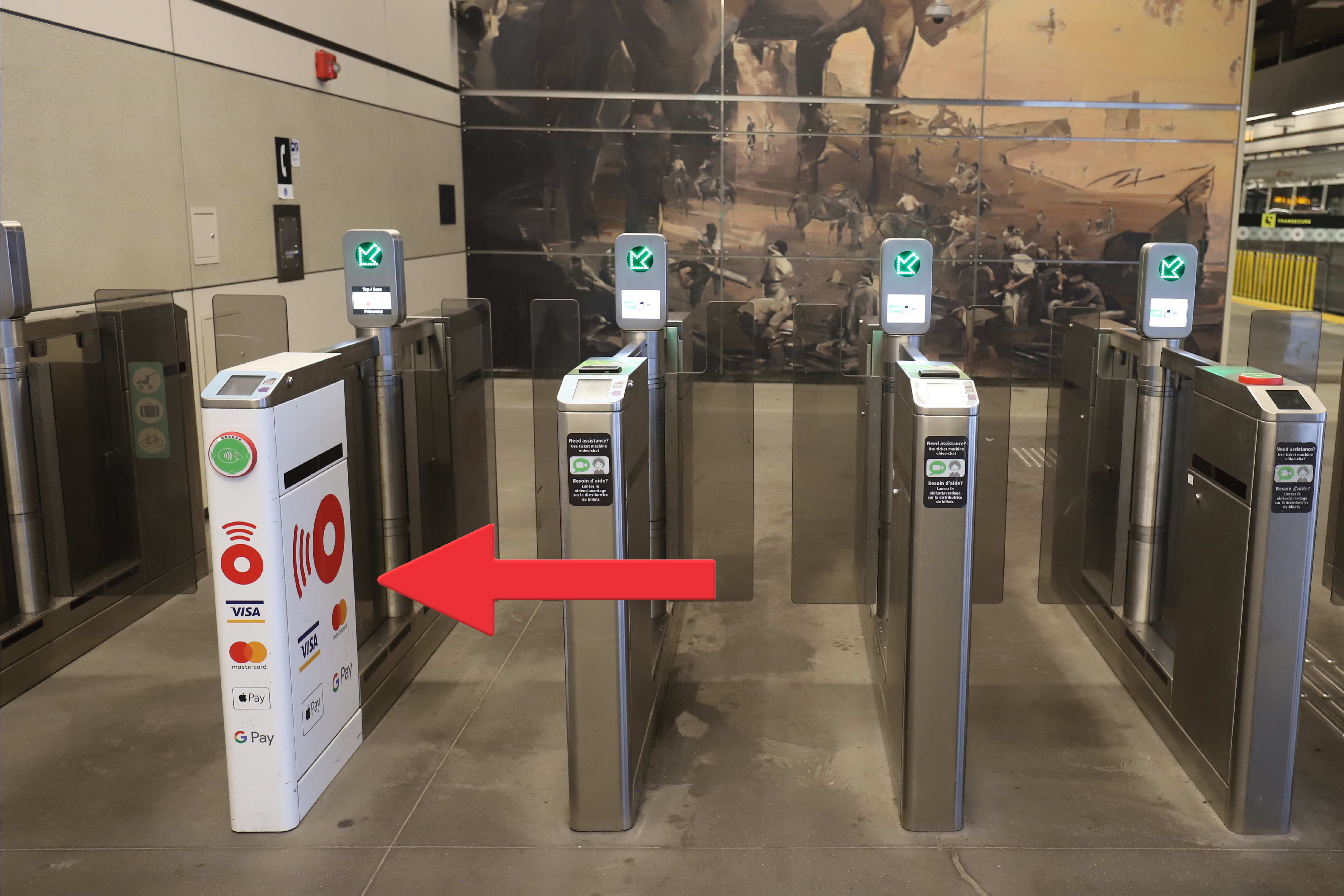 Look for the specially marked white fare gates which have already been activated to accept credit card and mobile phone taps.