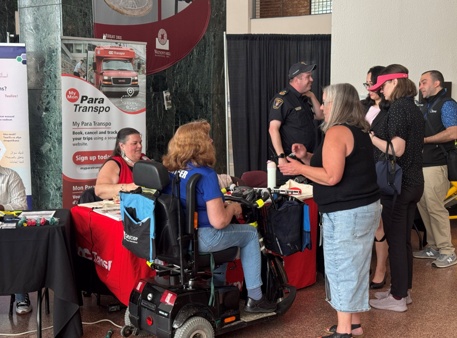 Customer service staff and Para Transpo customers at AccessAbility Day event