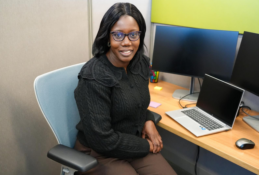 Zeva, Project & Policy Coordinator at her desk